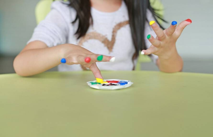 asian-girl-with-colorful-fingers-painted-children-room_38678-4783.jpg