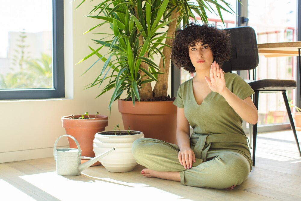 young-pretty-arab-woman-home-with-watering-can-plants_1194-111307.jpg