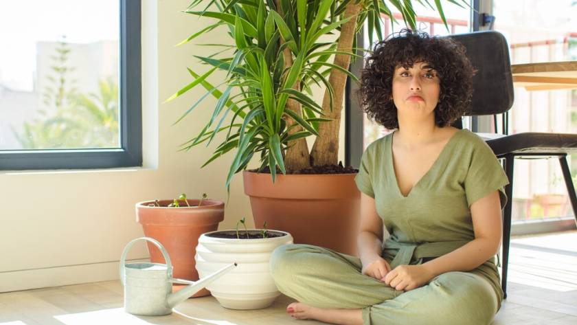 young-pretty-woman-with-watering-can-plants_1194-115696.jpg