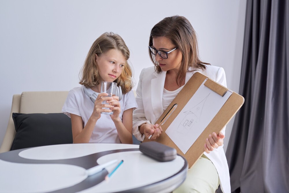 child-psychologist-talking-girl-kid-office-psychology-psychotherapy-professional-counseling-mental-help-children-counselor-looks-childs-drawing_116407-10714.jpg