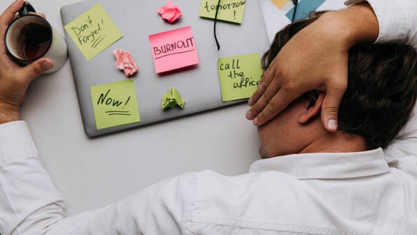 man-sleeps-his-work-desk-top-view-overwork-cocnept_253401-6423.jpg