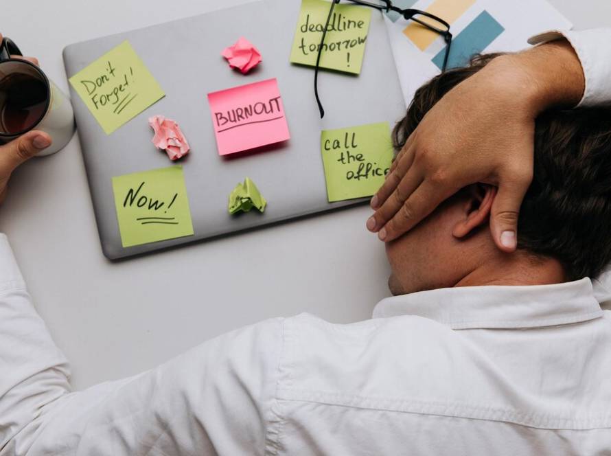 man-sleeps-his-work-desk-top-view-overwork-cocnept_253401-6423.jpg