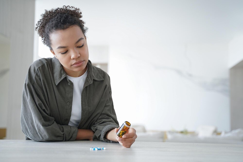 pensive-young-woman-holds-bottle-with-medicines-doubt-whether-take-pills-healthcare-copy-space_95891-9017.jpg