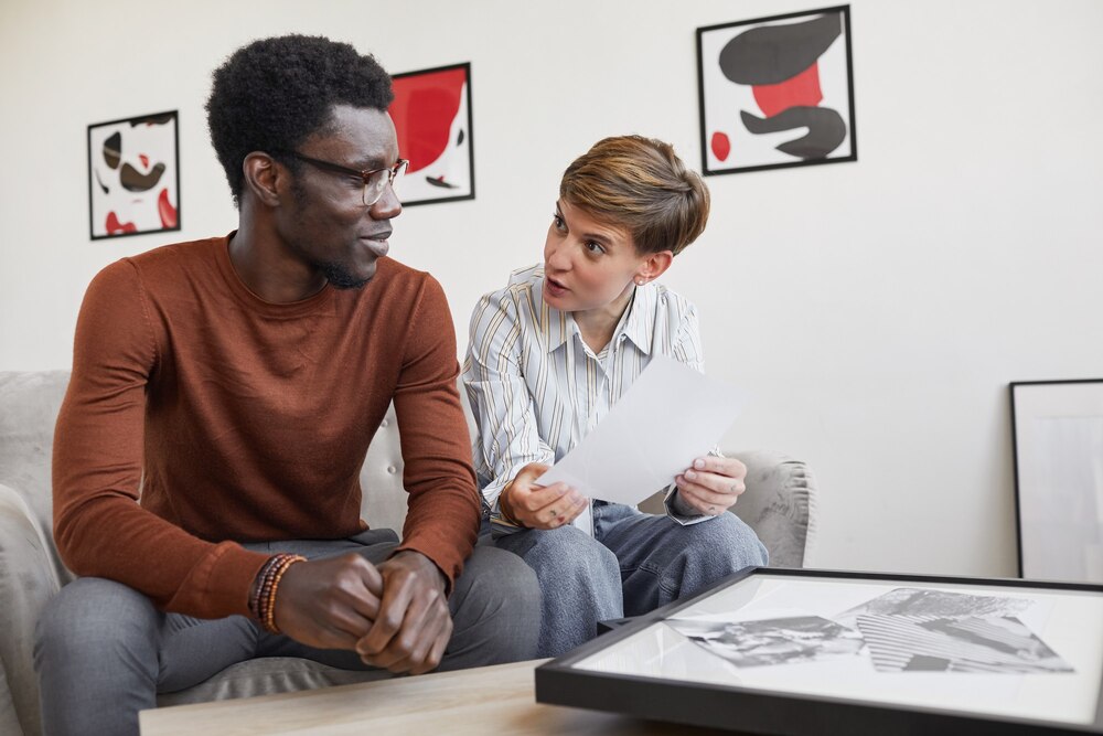 portrait-african-american-man-talking-female-art-gallery-manager-while-discussing-paintings-planning-exhibition-museum_236854-25849.jpg